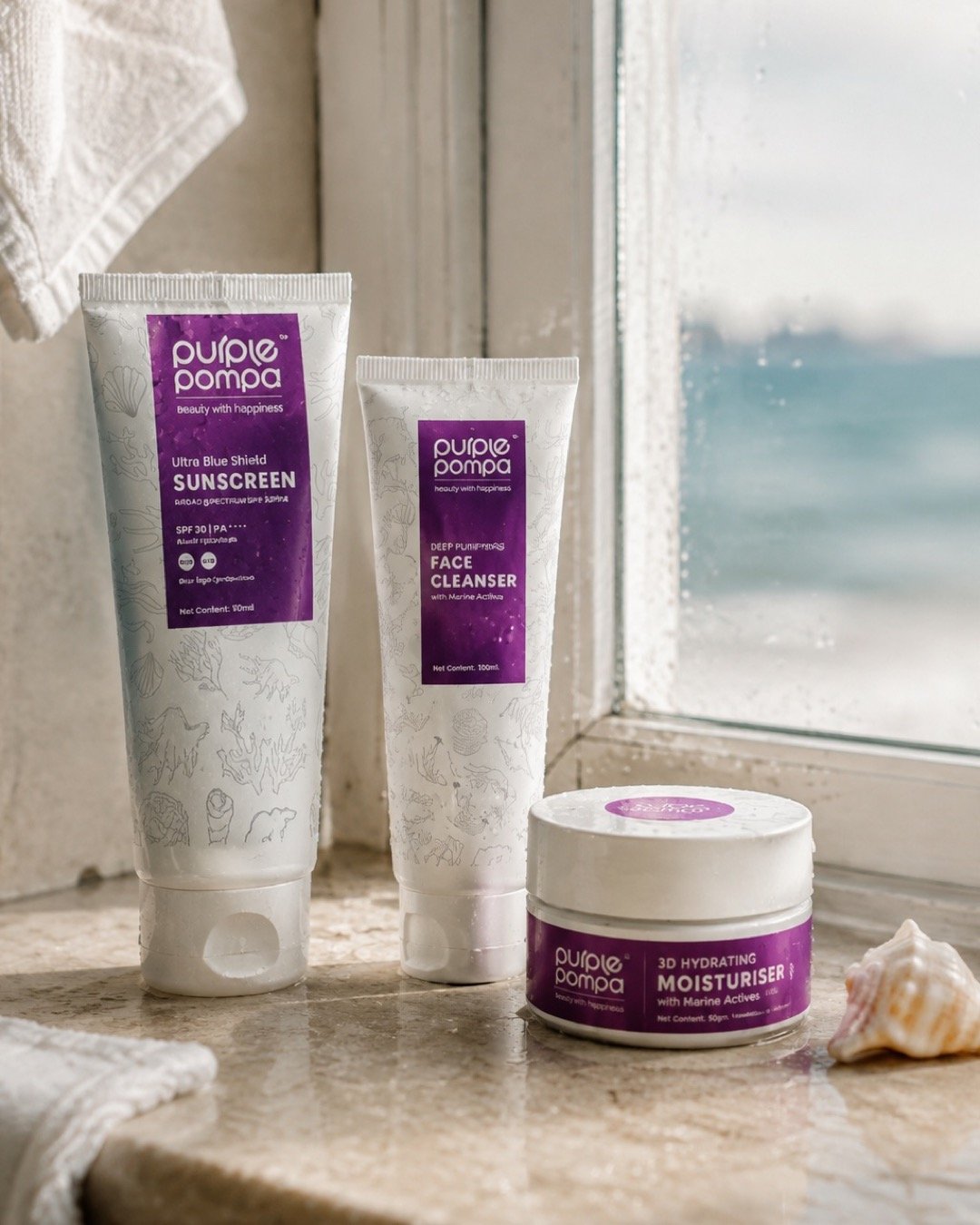 Purple Pompa sunscreen, face cleanser and moisturiser on a wet stone ledge